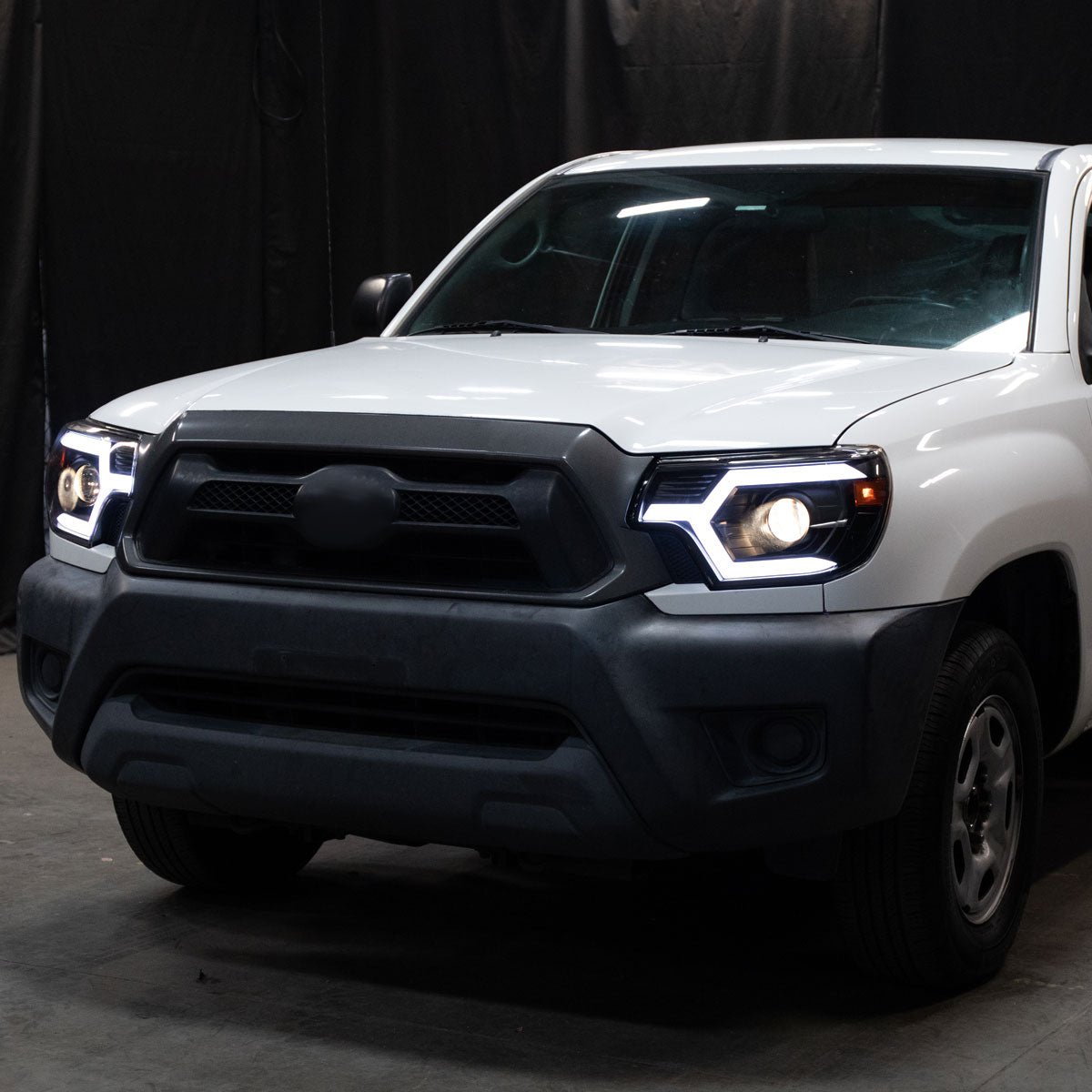 2012-2015 Toyota Tacoma Switchback Sequential LED Bar Projector Headlights (Matte Black Housing/Smoked Lens)
