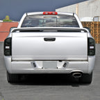 2002-2006 Dodge RAM 1500/2500/3500 White LED Bar Tail Lights (Matte Black Housing/Smoked Lens)