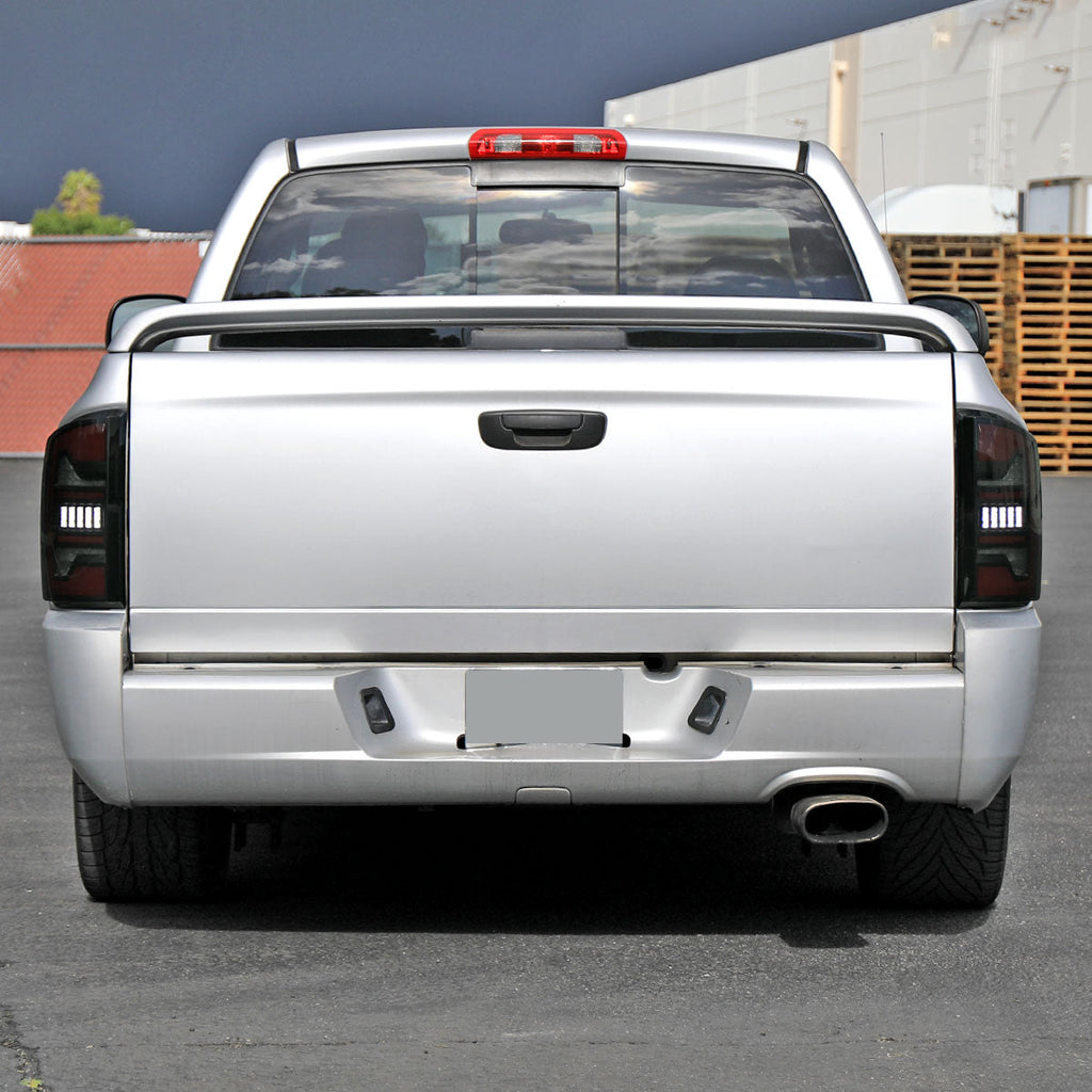 2002-2006 Dodge RAM 1500/2500/3500 Red LED Bar Tail Lights (Matte Black Housing/Smoked Lens)