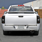 2002-2006 Dodge RAM 1500/2500/3500 Red LED Bar Tail Lights (Matte Black Housing/Smoked Lens)
