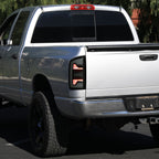 2007-2009 Dodge RAM 1500/2500/3500 White LED Bar Tail Lights (Matte Black Housing/Smoked Lens)