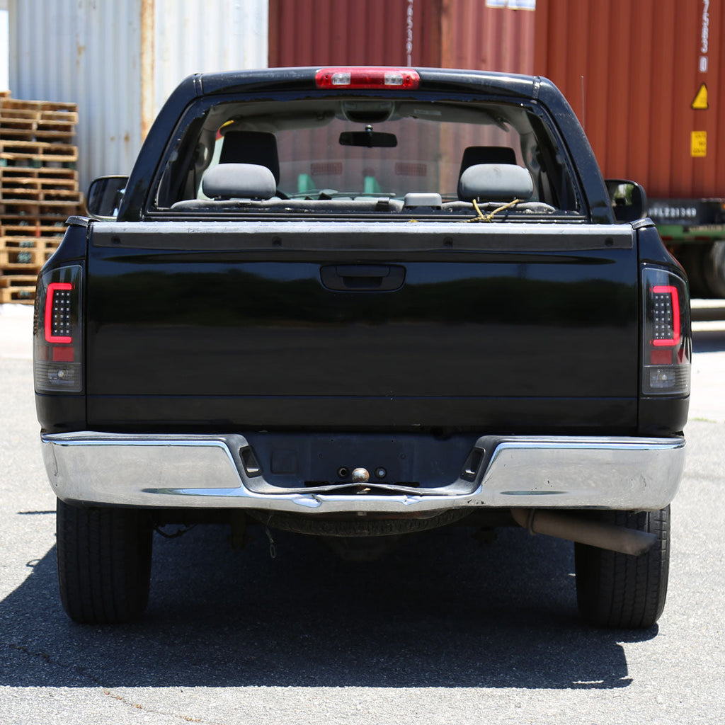 2007-2009 Dodge RAM 1500/2500/3500 Red C-Bar LED Tail Lights (Jet Black Housing/Clear Lens)