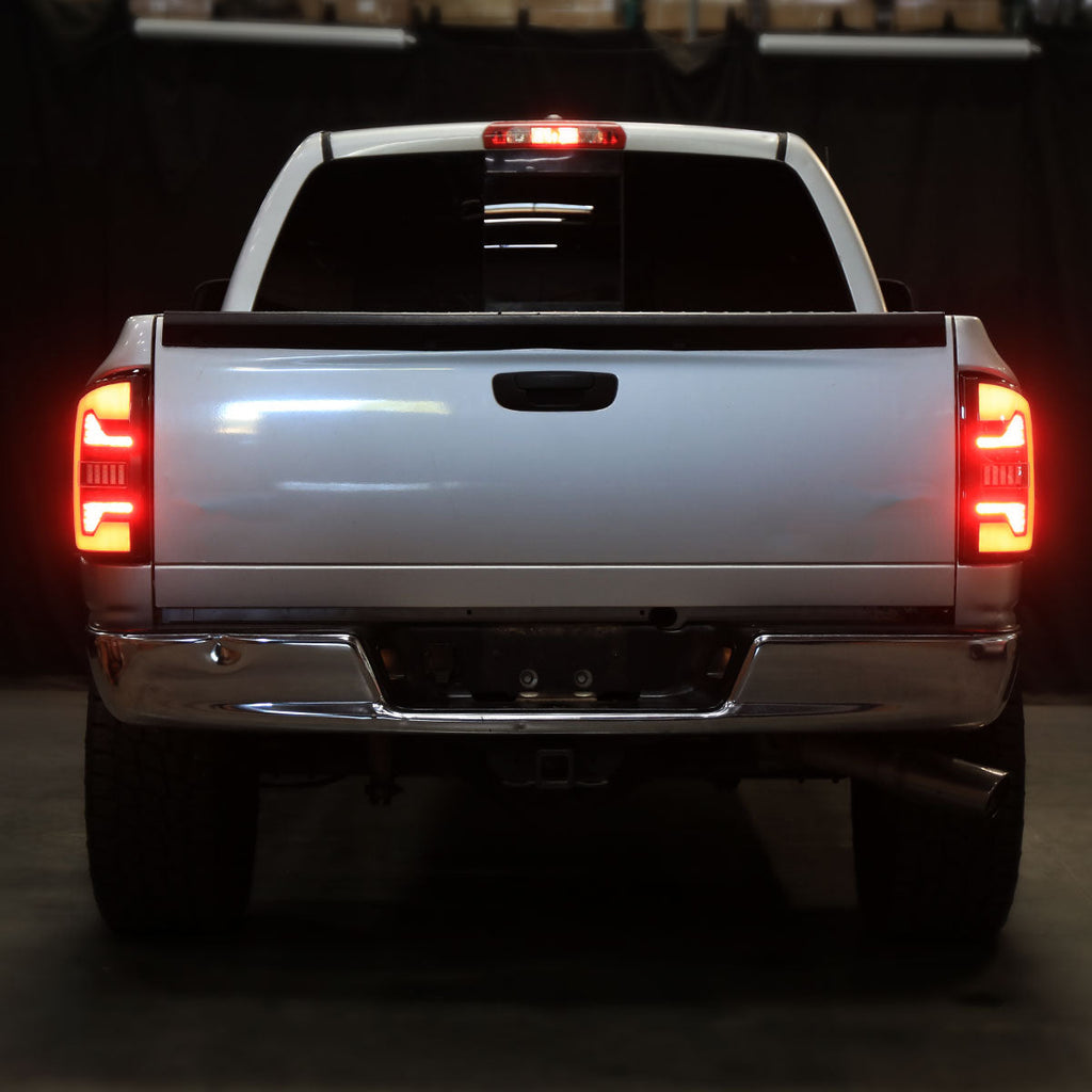 2007-2009 Dodge RAM 1500/2500/3500 Red LED Bar Tail Lights (Matte Black Housing/Smoked Lens)